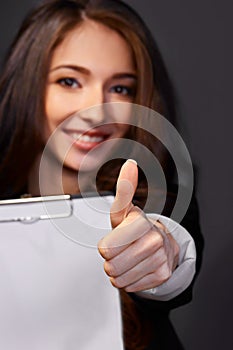 Portrait of business woman with paper folder,smiles