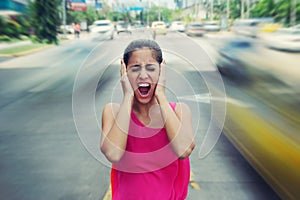 Portrait business woman screaming at street car traffic