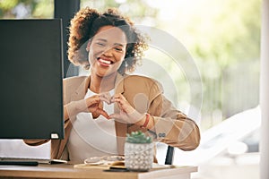 Portrait, business woman and smile with heart hands in office for care, kindness or love emoji. Happy young African