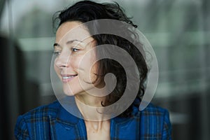 Portrait of a business woman smiling looking aside