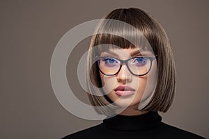 Portrait of a business woman in strict glasses. Bob haircut