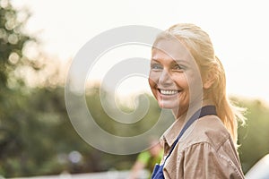 Portrait of business woman on sunny nature background
