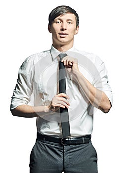 Portrait of businessman adjusting tie on neck