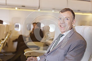 Portrait of businessman on an airplane, Passenger Relaxing