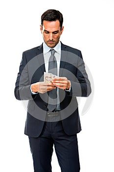 portrait of a businessman counting money