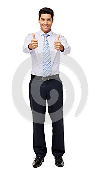 Portrait Of Businessman Gesturing Thumbs Up