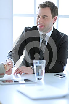 Portrait of businessman giving hand for handshake