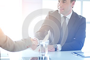 Portrait of businessman giving hand for handshake