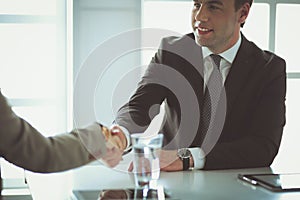 Portrait of businessman giving hand for handshake