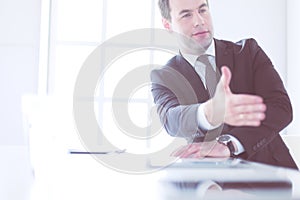 Portrait of businessman giving hand for handshake