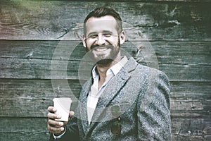 Portrait of businessman having break with coffee