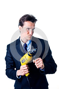 Portrait of businessman holding drill