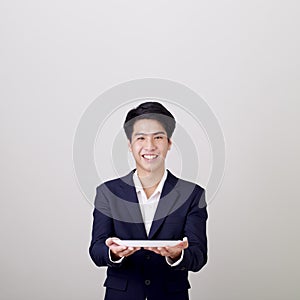 Portrait businessman holding empty plate