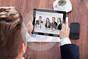 Portrait Of A Businessman Looking At Digital Tablet