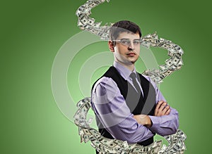 Portrait of businessman with money vortex