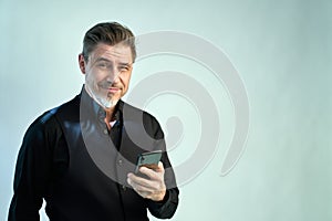 Portrait of businessman with phone on white