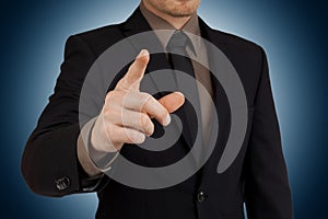 Portrait of businessman pointing finger at viewer