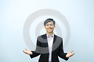 Portrait of businessman standing with open arms.