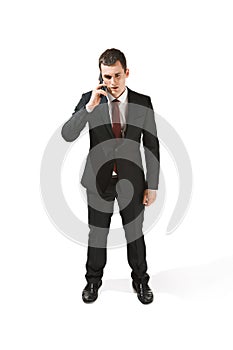 Portrait of a businessman with very serious face. Confident professional with piercing look in the foreground of the