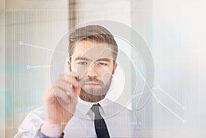 Portrait of a businessman working with digital virtual screen