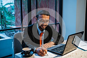 portrait of businessman working late at his office