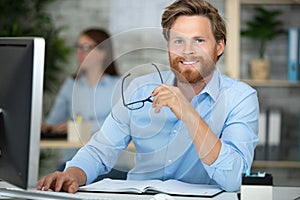 Portrait businessman working in office