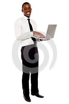 Portrait of businessperson holding laptop photo