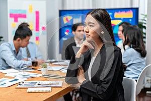 Portrait of businesswoman or analyst looking at camera in meeting. Habiliment