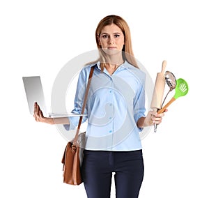 Portrait of businesswoman with briefcase holding kitchen utensils and laptop on white background