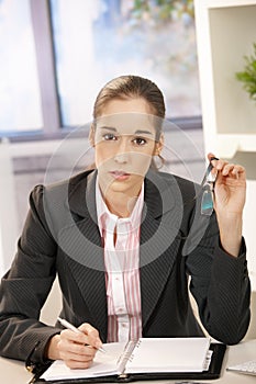 Portrait of businesswoman at desk