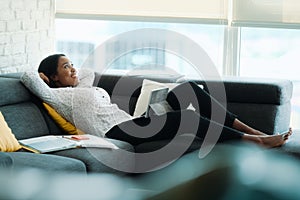 Portrait Of Businesswoman Doing Remote Work On Sofa