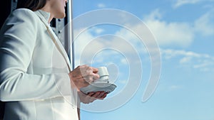 Portrait businesswoman drinking coffee on cloudy sky view. Woman taking break