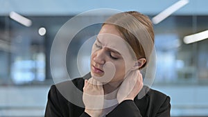 Portrait of Businesswoman having Neck Pain