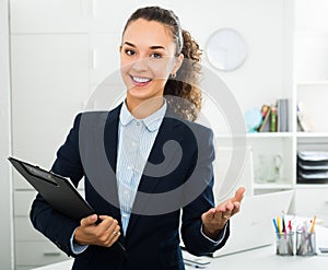 Portrait businesswoman holding documents in hands