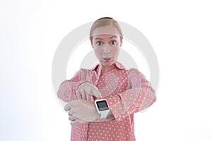 Businesswoman pointing at her smartwatch