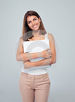 Portrait of a businesswoman standing with folder