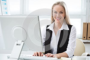 Portrait of businesswoman working with computer