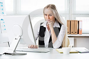 Portrait of businesswoman working with computer