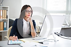 Portrait of businesswoman working with computer