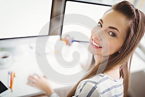 Portrait of businesswoman working in creative office