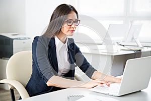 Portrait of businesswoman working with laptop