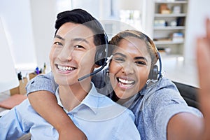 Portrait of call center colleagues taking a selfie showing diversity at the workplace. Business People working customer