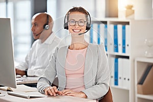 Portrait, call center and customer service with a woman consulting using a headset in her telemarketing office. Sales