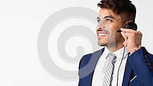 Portrait Of Call Center Operator In Headset Over White Background