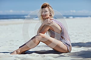 Portrait of a calm woman taking a sunbath by the sea