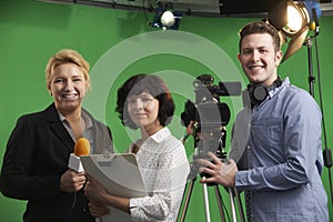 Portrait Of Cameraman With Presenter And Floor Manager In Televi