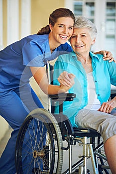 Portrait, caregiver or happy elderly woman in a wheelchair in hospital helping a mature patient for support. Smile