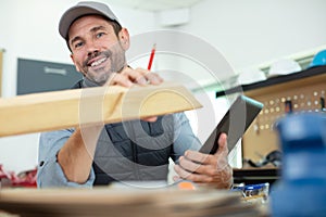 portrait carpenter standing in woodwork