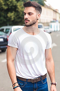 Portrait of casual man looking to side while on street