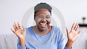 Portrait of casual young African American woman laughing